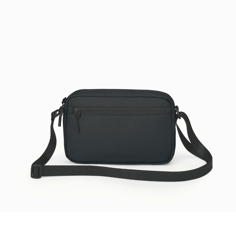 Back view of Osprey Aoede crossbody bag black featuring rear security pocket and premium ballistic construction