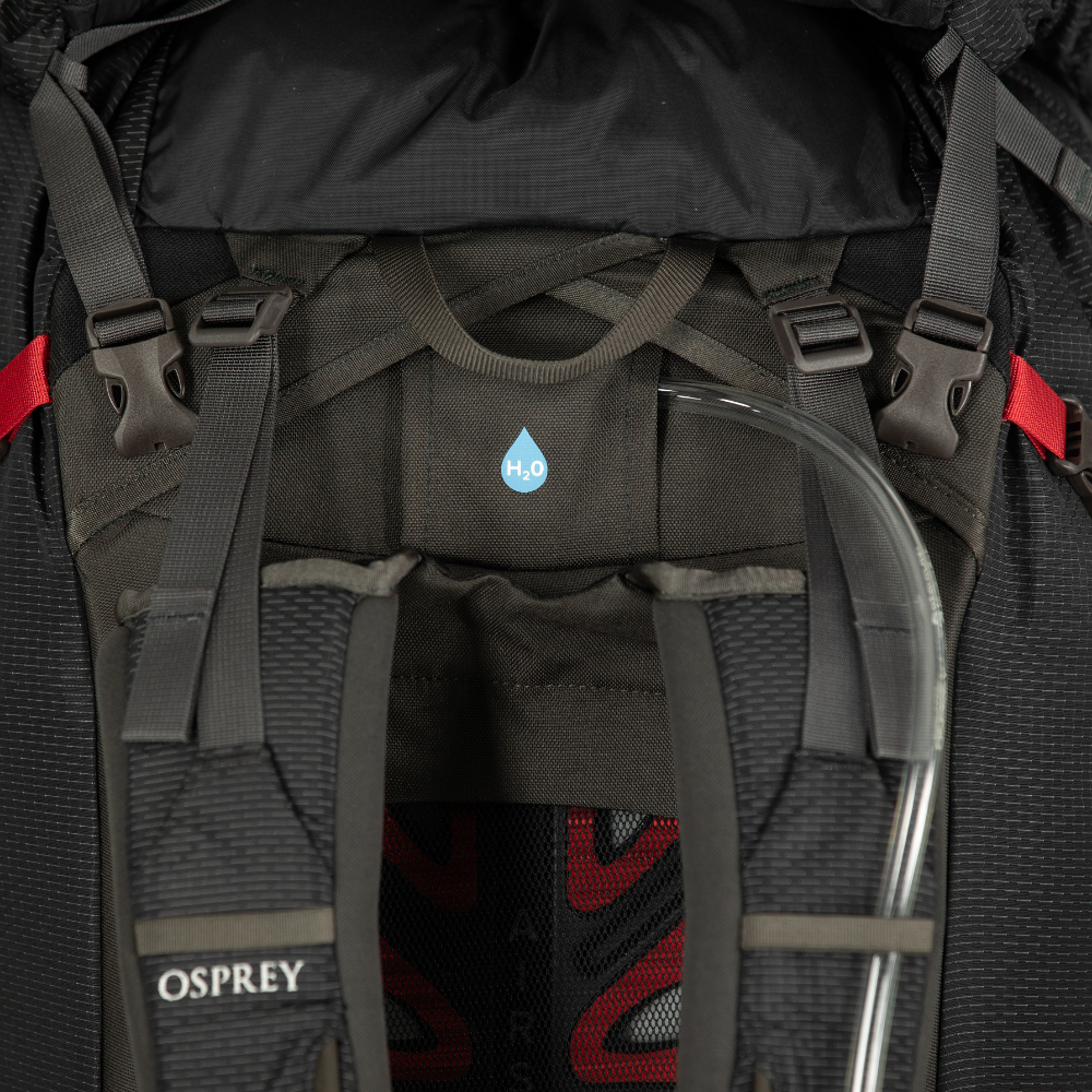 Close-up of a black Osprey backpack with visible branding and design details.