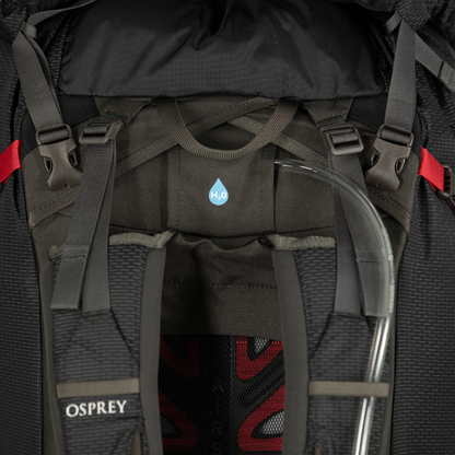 Close-up of a black Osprey backpack with visible branding and design details.