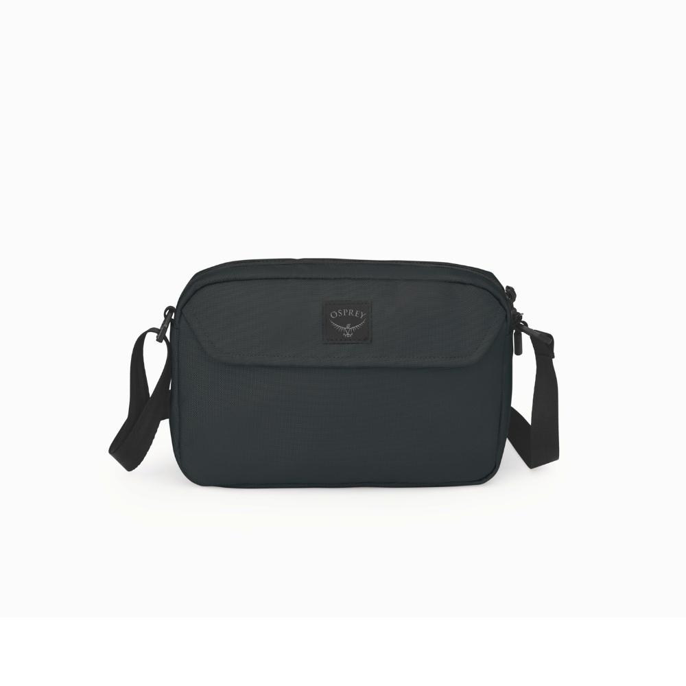 Front view of Osprey Aoede crossbody bag black showing minimalist design and magnetic flap pocket
